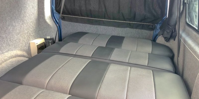 Volkswagen camping van rear bed.